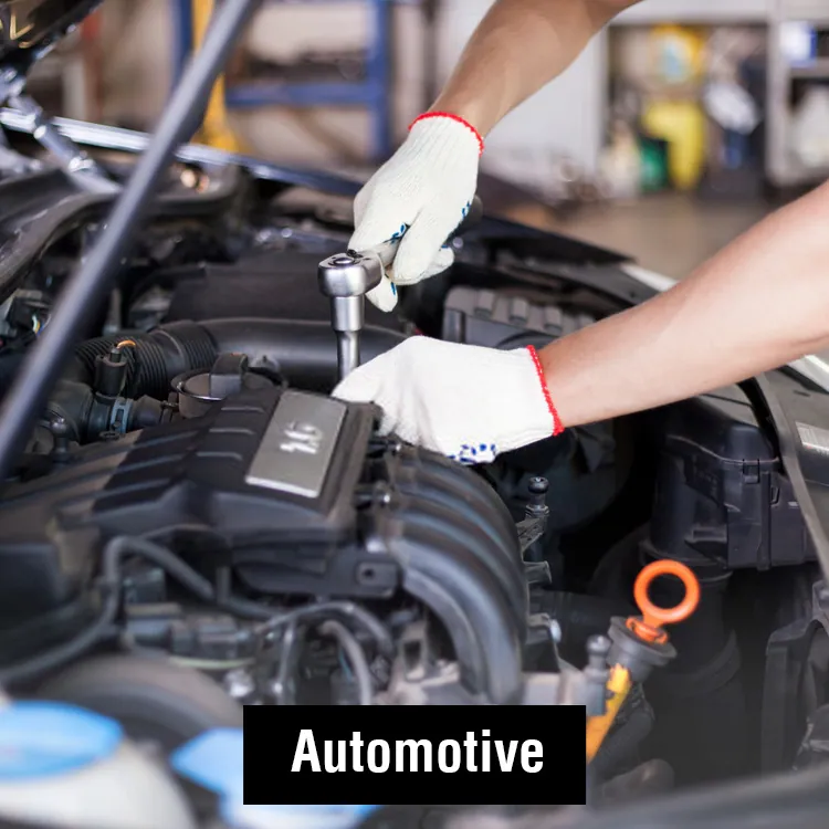 Gloved hands working under a car bonnet: our automotive range